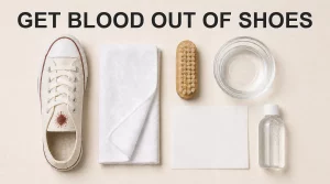 A white canvas sneaker with a visible brown-red mark in a text-free cleaning flat lay.